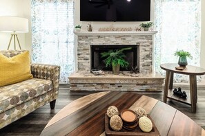 Smart TV, fireplace, books, offices