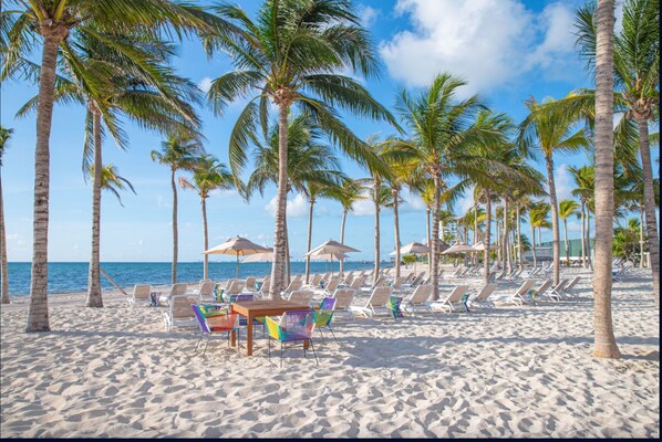On the beach, sun loungers, beach towels