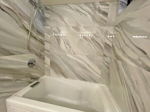 Combined shower/tub, hair dryer, towels, soap