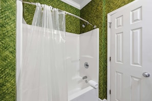 Bathtub, hair dryer, towels