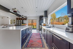 Fridge, dishwasher, dining tables, kitchen islands