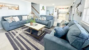 A living room with two sofas, a coffee table, and a rug. - 6BR | Sleeps 16 | Pool | Steps To The Beach |20427 (North Myrtle Beach)
