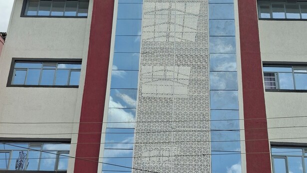 A building with the sign 'JMS PLAZA' at the top.