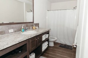 Bathtub, hair dryer, towels, soap