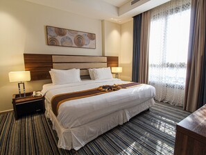 Deluxe Suite | Minibar, in-room safe, blackout drapes, iron/ironing board - Friesian Hotel (Jeddah)