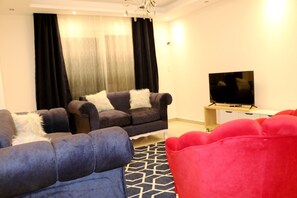 Apartment | Living room - Red Flower in Palm City Compound 1 Hour to the sea (Cairo)
