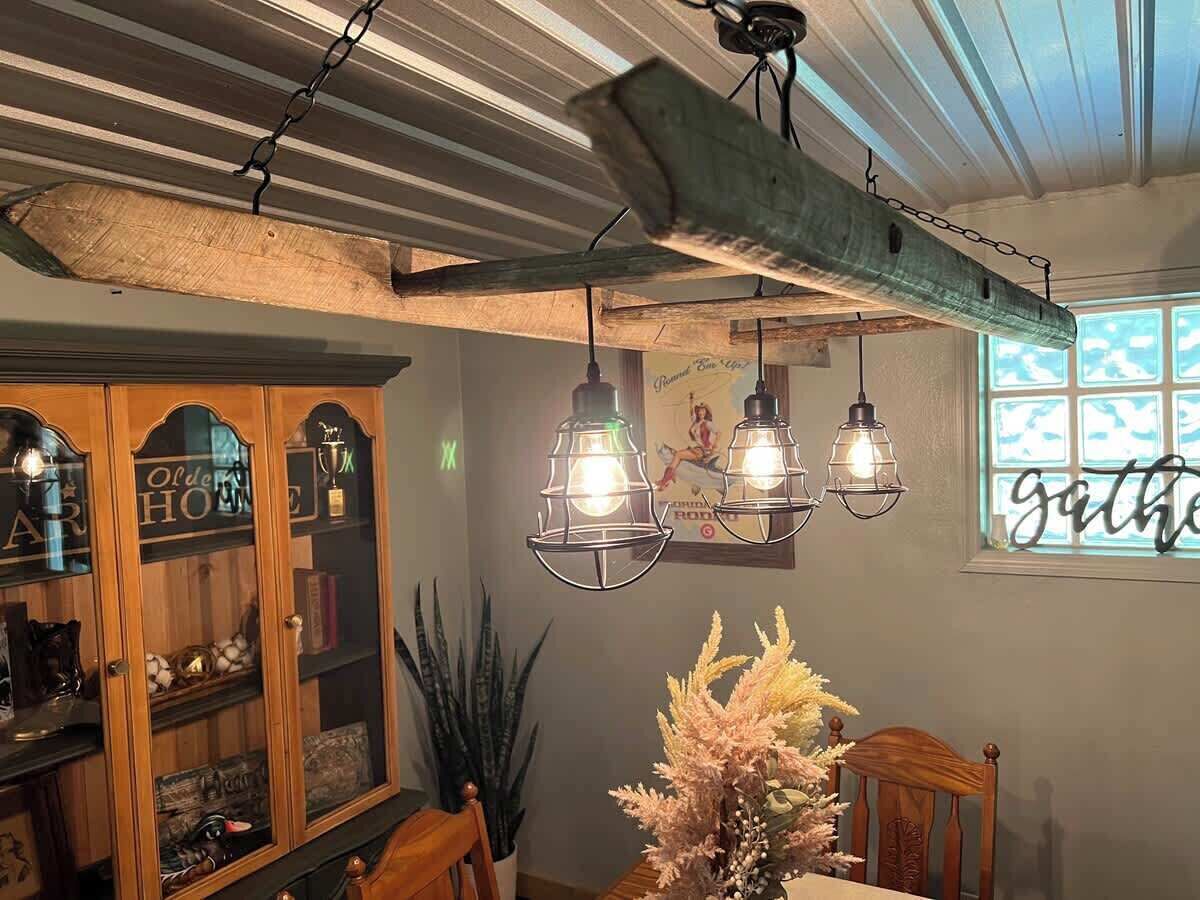 Chandelier made with an actual grove ladder used in Quets orange grove. 
