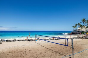 Enjoy a game of beach volleyball with ocean views from the nearby balcony.