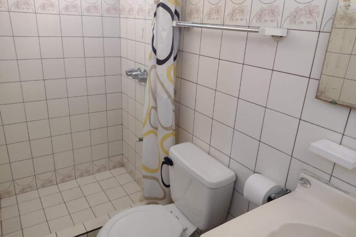 standard double room | bathroom | shower, free toiletries, towels, soap