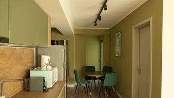 Deluxe Apartment | Private kitchenette | Full-size fridge, microwave, stovetop, coffee/tea maker