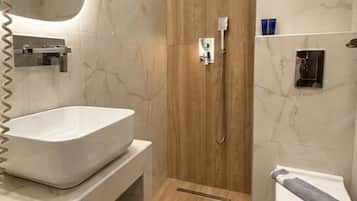 Shower, hair dryer, slippers, towels