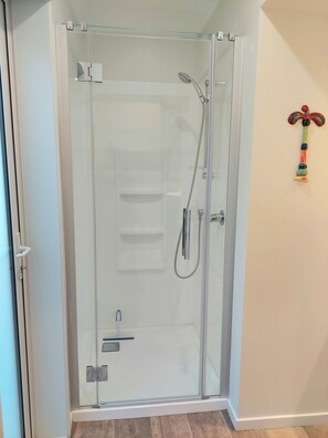 Shower, hair dryer, towels, toilet paper - Seascape<br>Modern 2 bedroom apartment on the Thames Coast (Ruamahunga)