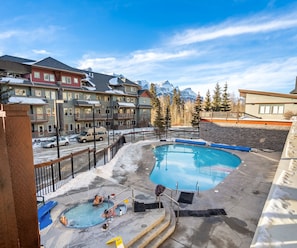 Outdoor pool, a heated pool - Heated outdoor Pool & Tubs 2 Bedroom & 2 Full baths 5 beds 9 Guests (Canmore)