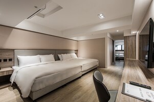 Deluxe Family Room | Down comforters, free minibar, blackout drapes, iron/ironing board