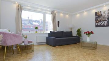 Deluxe Condo | Living area | Smart TV