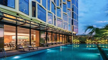 Outdoor pool, open 6:00 AM to 8:00 PM, pool loungers