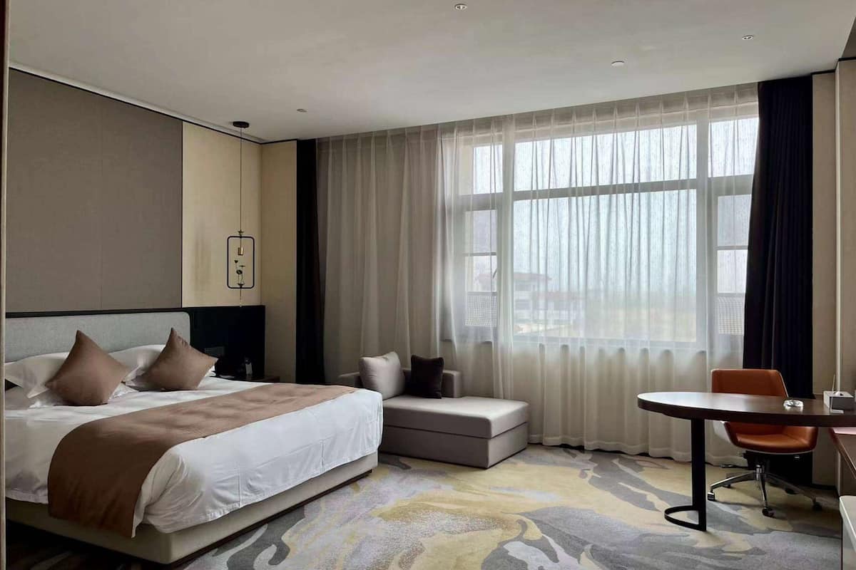 Deluxe Suite, 1 King Bed, Non Smoking (Separate Building) | In-room safe, iron/ironing board, free WiFi, bed sheets