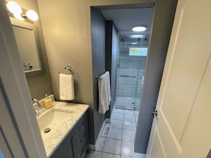 Shower, hair dryer, towels, toilet paper