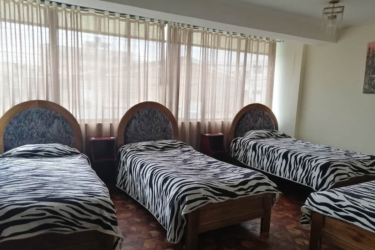 Economy Quadruple Room | Individually decorated, individually furnished, free WiFi, bed sheets