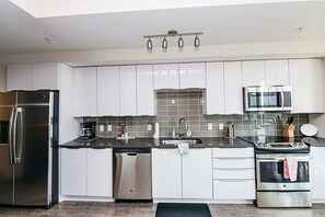 Apartment, 1 Bedroom | Private kitchen | Fridge, oven, coffee/tea maker, electric kettle
