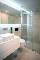 Family Studio | Bathroom | Shower, hair dryer, towels