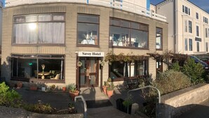 A two-story building with a sign reading "Savoy Hotel" at the entrance. - Savoy Hotel (Weston-super-Mare)