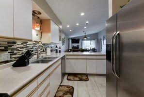 Condo, Multiple Beds, Balcony, Golf View | Private kitchen | Fridge, microwave, oven, stovetop