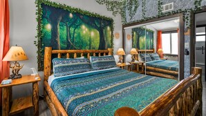 A room with a bed, nightstands, a mirror, and a large forest-themed wall mural. - Disney Explorer - Sauna, Theater, Arcade and More! (Garden Grove)