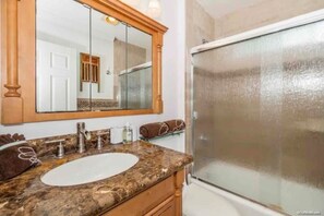 Combined shower/bathtub, hair dryer, towels, soap