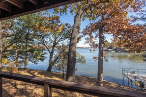 A lakeside view with trees, a dock, and a clear sky. - Lone Oak Point 14 - Two Bedroom Apartment, Sleeps 6 (Sunrise Beach)