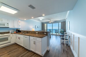 Enjoy ocean views from the kitchen's central island, which opens up to a spacious balcony.