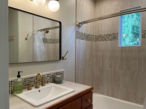 Combined shower/tub, towels, soap, toilet paper