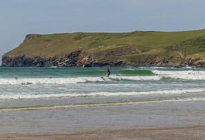 Guests can enjoy surfing on the sandy beach.