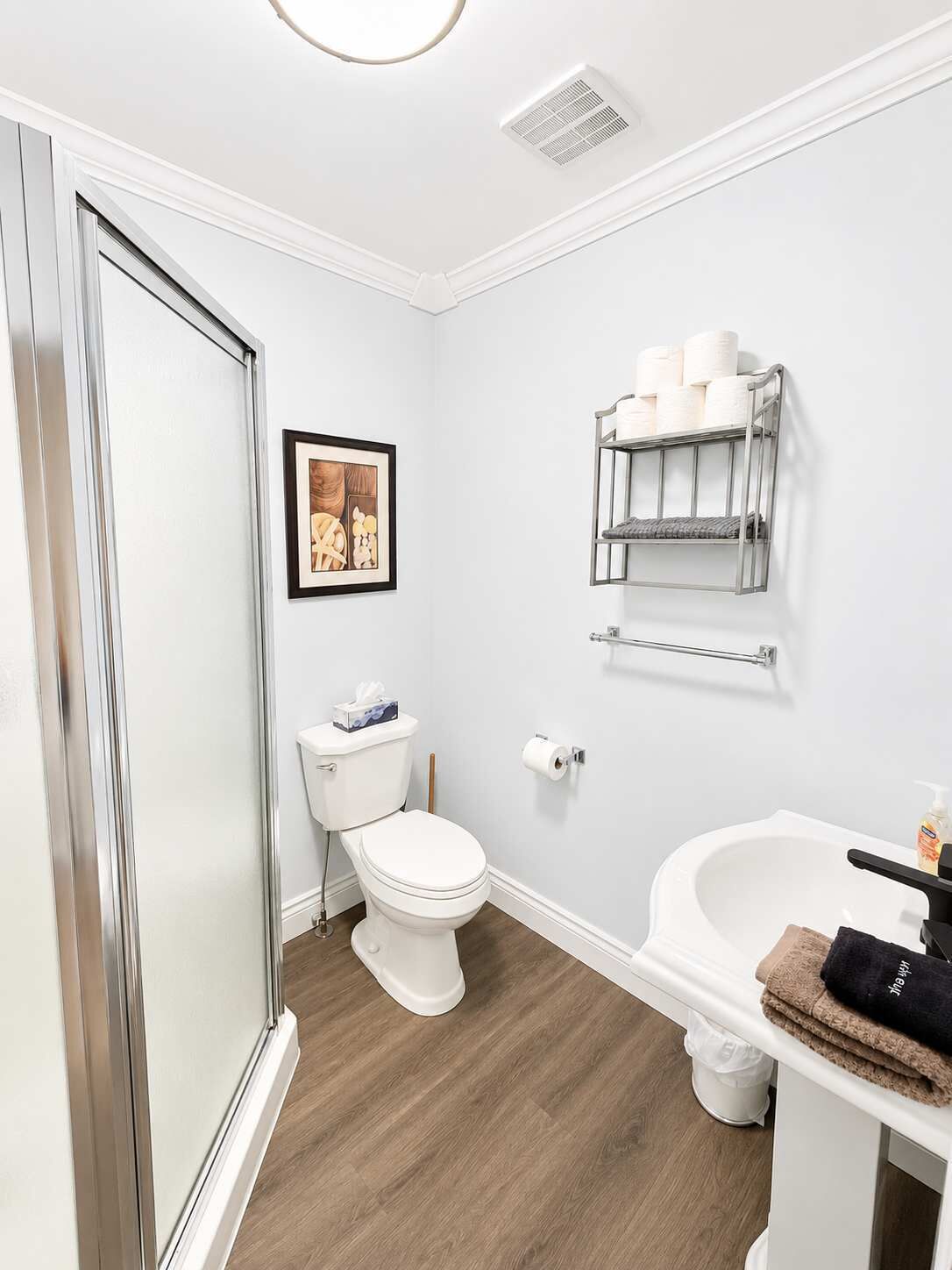 Bathtub, hair dryer, towels, shampoo