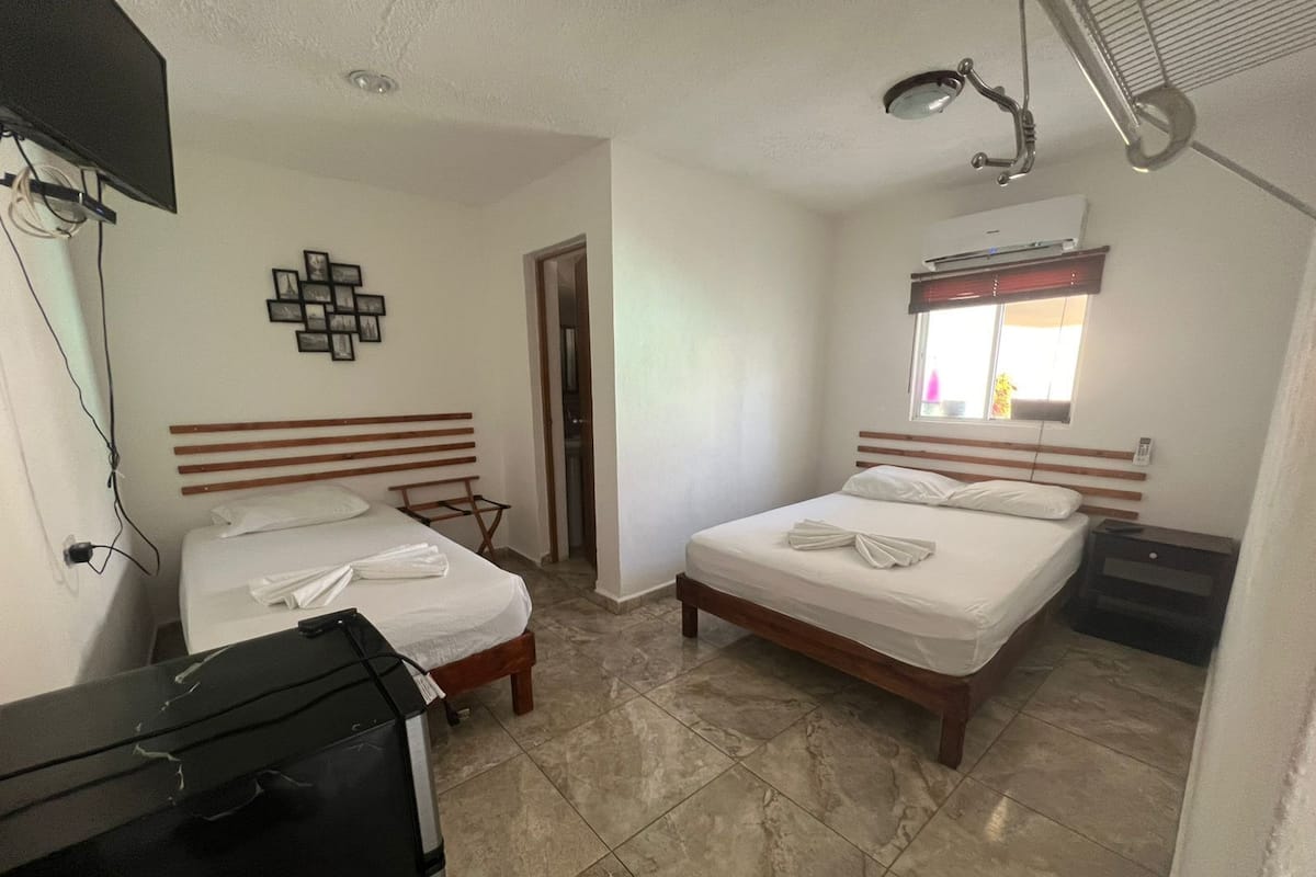 Economy Triple Room | Down comforters, WiFi (free), bed sheets