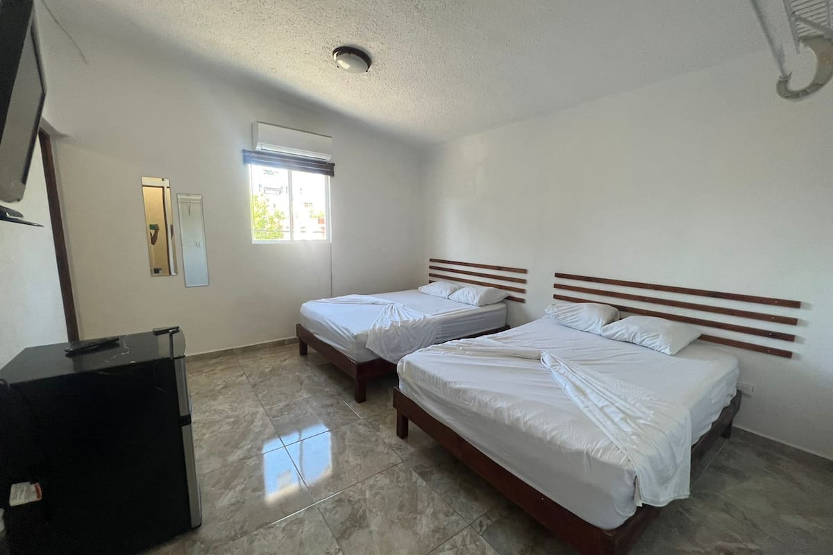 Economy Quadruple Room | Down comforters, WiFi (free), bed sheets