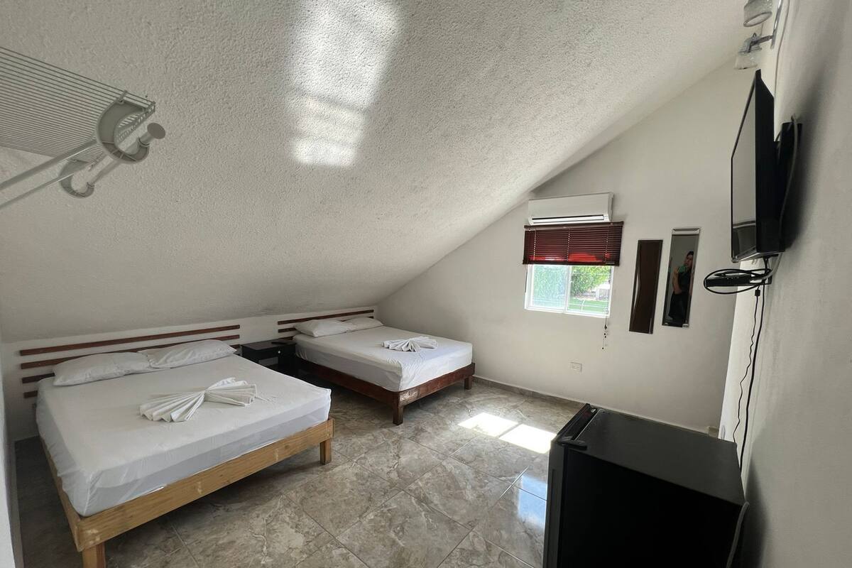 Economy Quadruple Room | Down comforters, WiFi (free), bed sheets