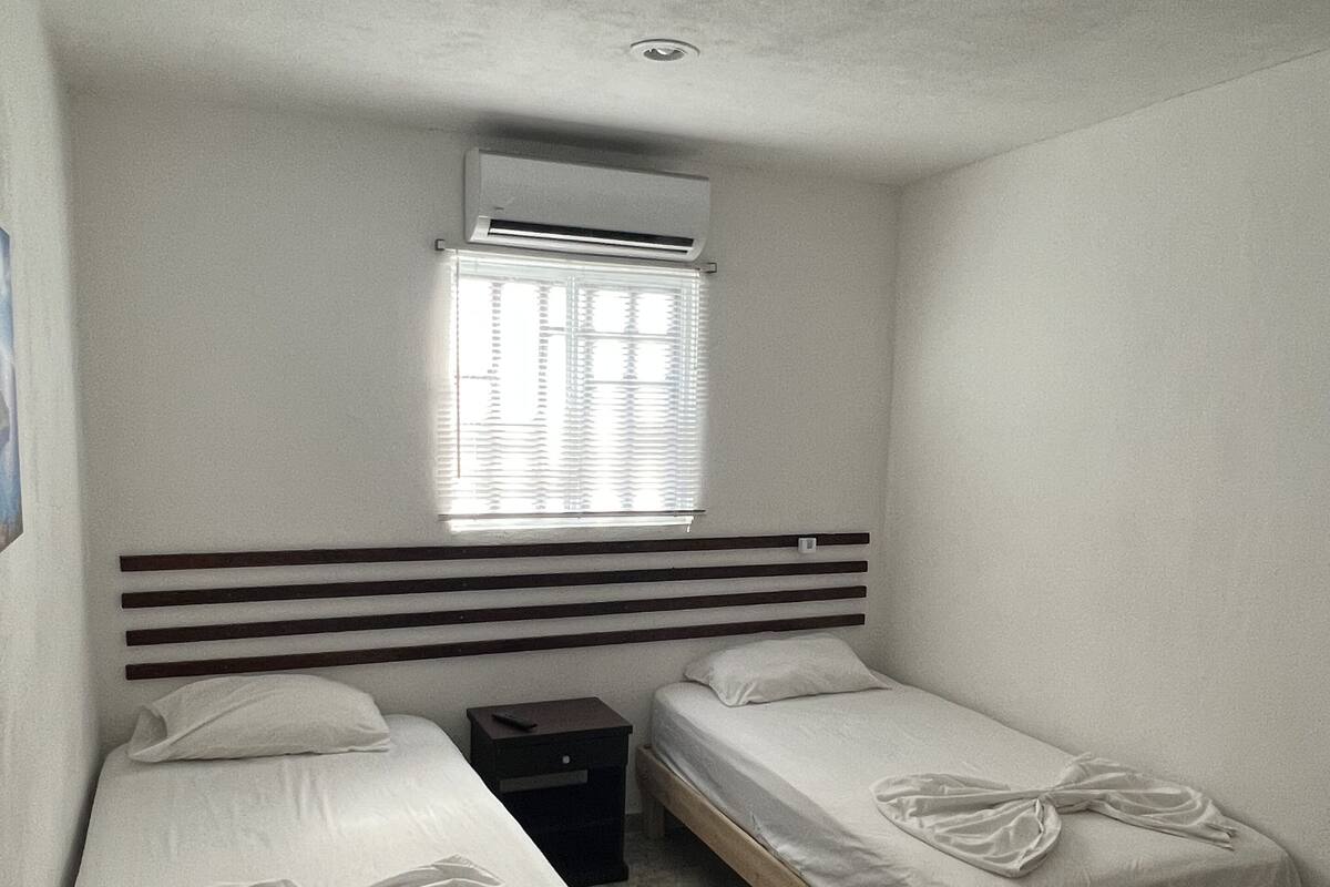 Economy Twin Room | Down comforters, WiFi (free), bed sheets