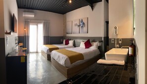 Habitación cuádruple Premium, 2 camas matrimoniales | Ropa de cama de alta calidad, edredón y camas con pillow-top 