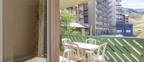 Enjoy stunning views from the private balcony, complete with outdoor seating for unwinding in the fresh mountain air.