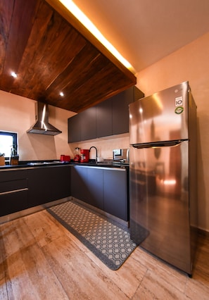 Fridge, microwave, stovetop, coffee/tea maker