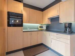 Microwave, dishwasher, toaster, dining tables