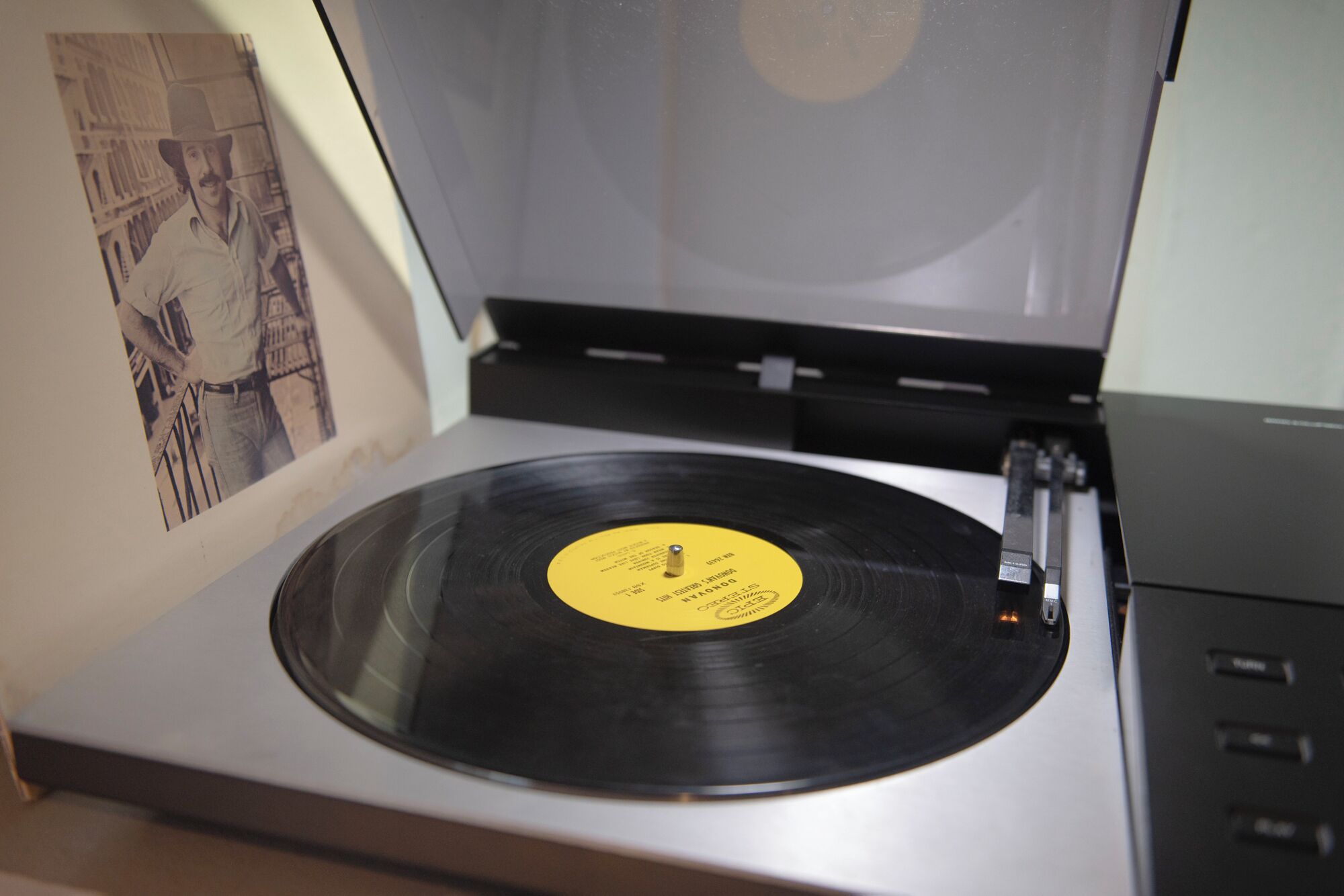 A turntable with a vinyl record on it.