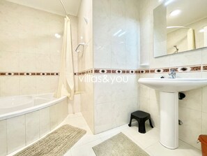 Bathtub, hair dryer, towels