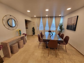 Enjoy meals in this stylish dining area with a glass-top table and six chairs.