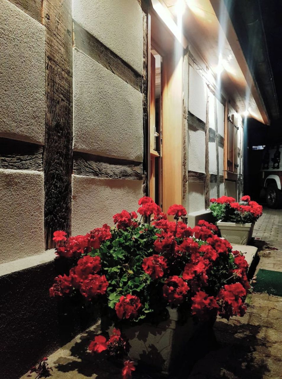 A building facade with textured walls and a door.