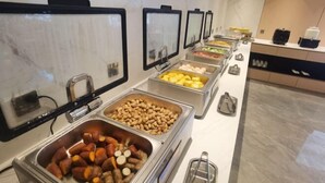 A buffet with various food options including meats, nuts, and fruits. - BoYea Hotel (Zhuhai Pingsha Ocean Spring Resort) (Zhuhai)
