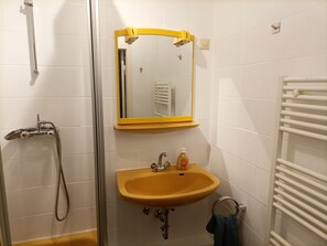 Shower, towels, soap, toilet paper
