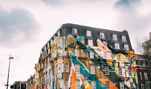 A multi-story building with colorful facades and traditional architectural features.