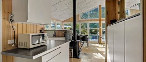 Fridge, stovetop, dishwasher, coffee/tea maker